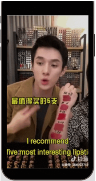 Li Jiaqi, live streaming sales guru known as the Lipstick King, doing a live ecommerce broadcast selling lipsticks. Showing lipstick shades on his arm.